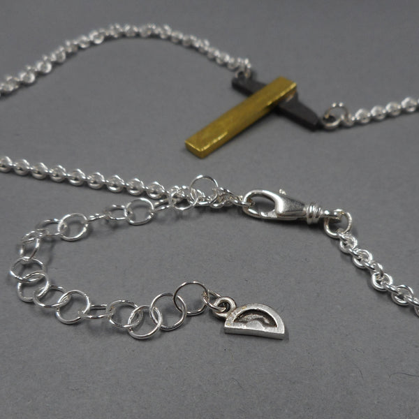 Lobster Claw clasp and extender charm on t-square necklace from Forged Mettle Jewelry