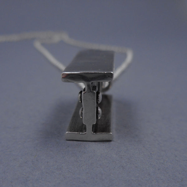 Side view of I-Beam Pendant from Forged Mettle Jewelry
