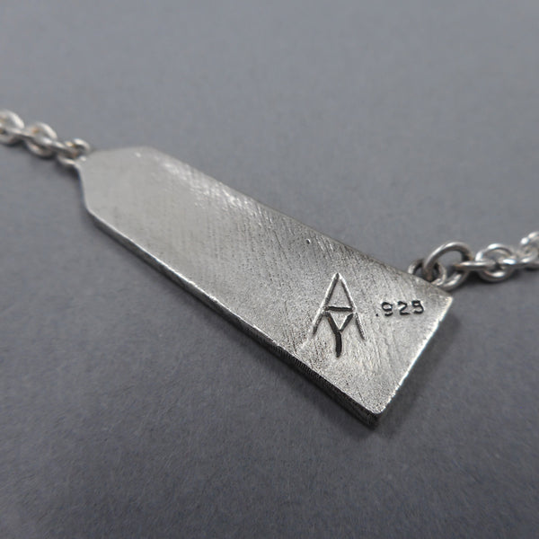 Forged Mettle Jewelry hallmark on Obelisk Jewelry