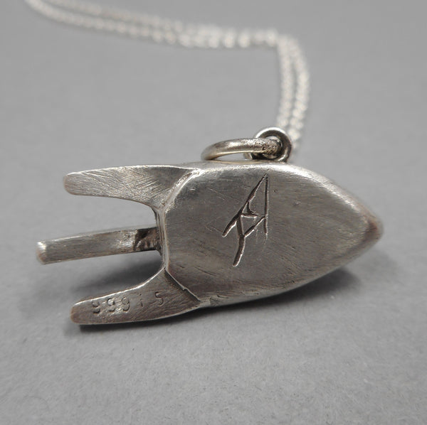 Back of Handcrafted Rocketship Necklace from Forged Mettle Jewelry