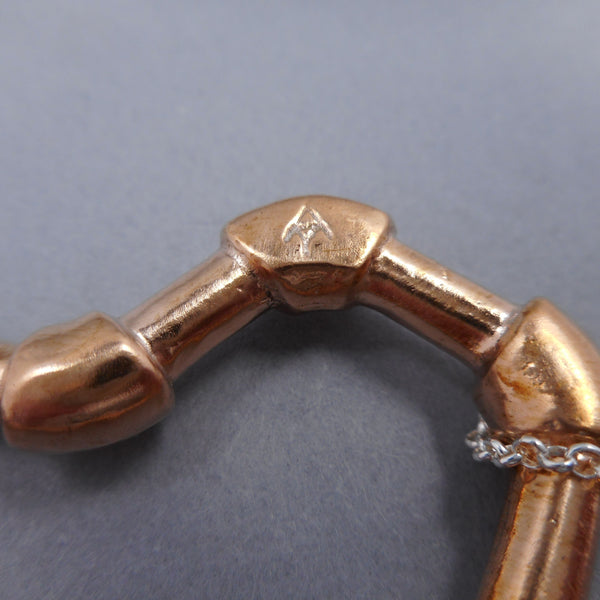 Hallmark of Forged Mettle Jewelry copper pipe heart