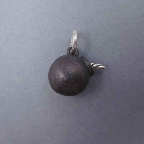 Solid sterling silver bomb charm from Forged Mettle Jewelry