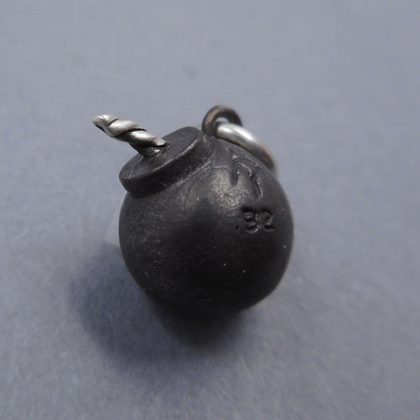 Handcrafted bomb charm from Forged Mettle Jewelry