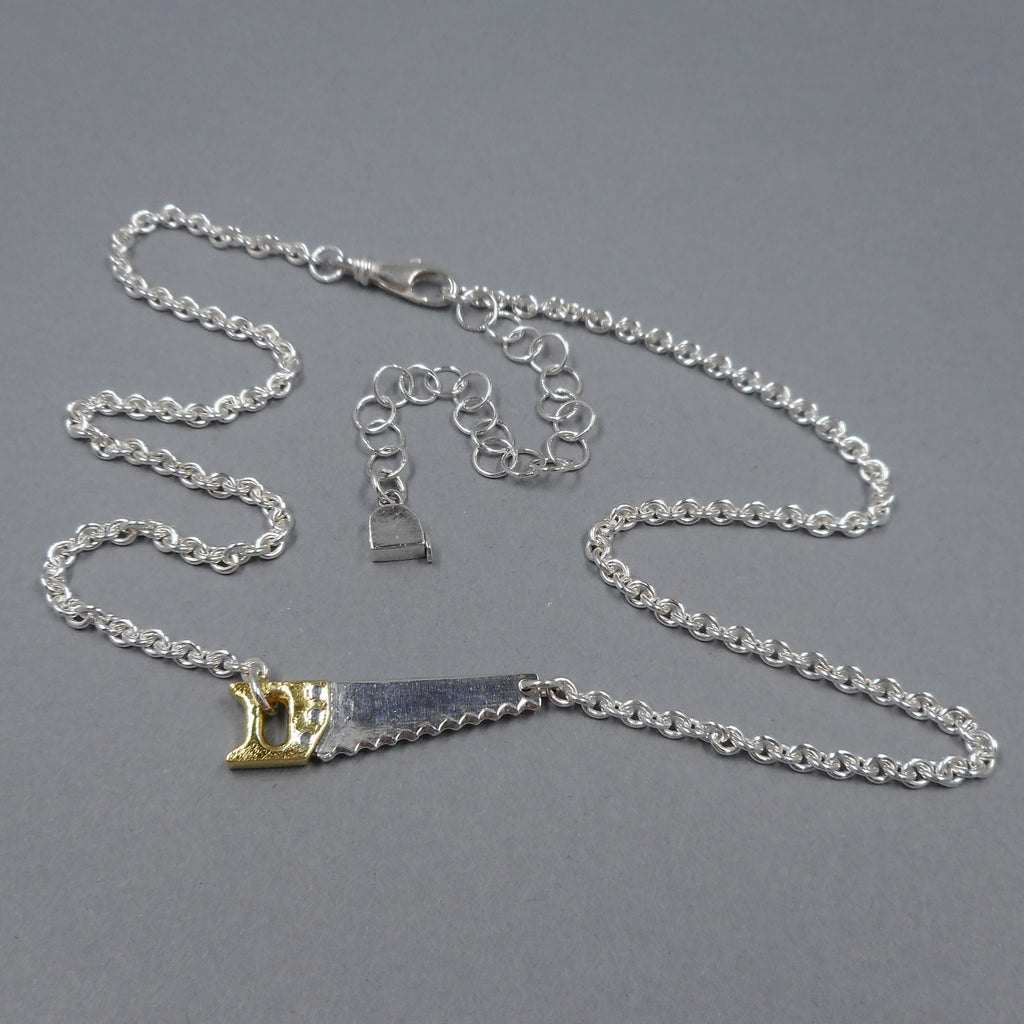 Hand Saw Necklace in Sterling Silver & 22k Gold from Forged Mettle Jewelry